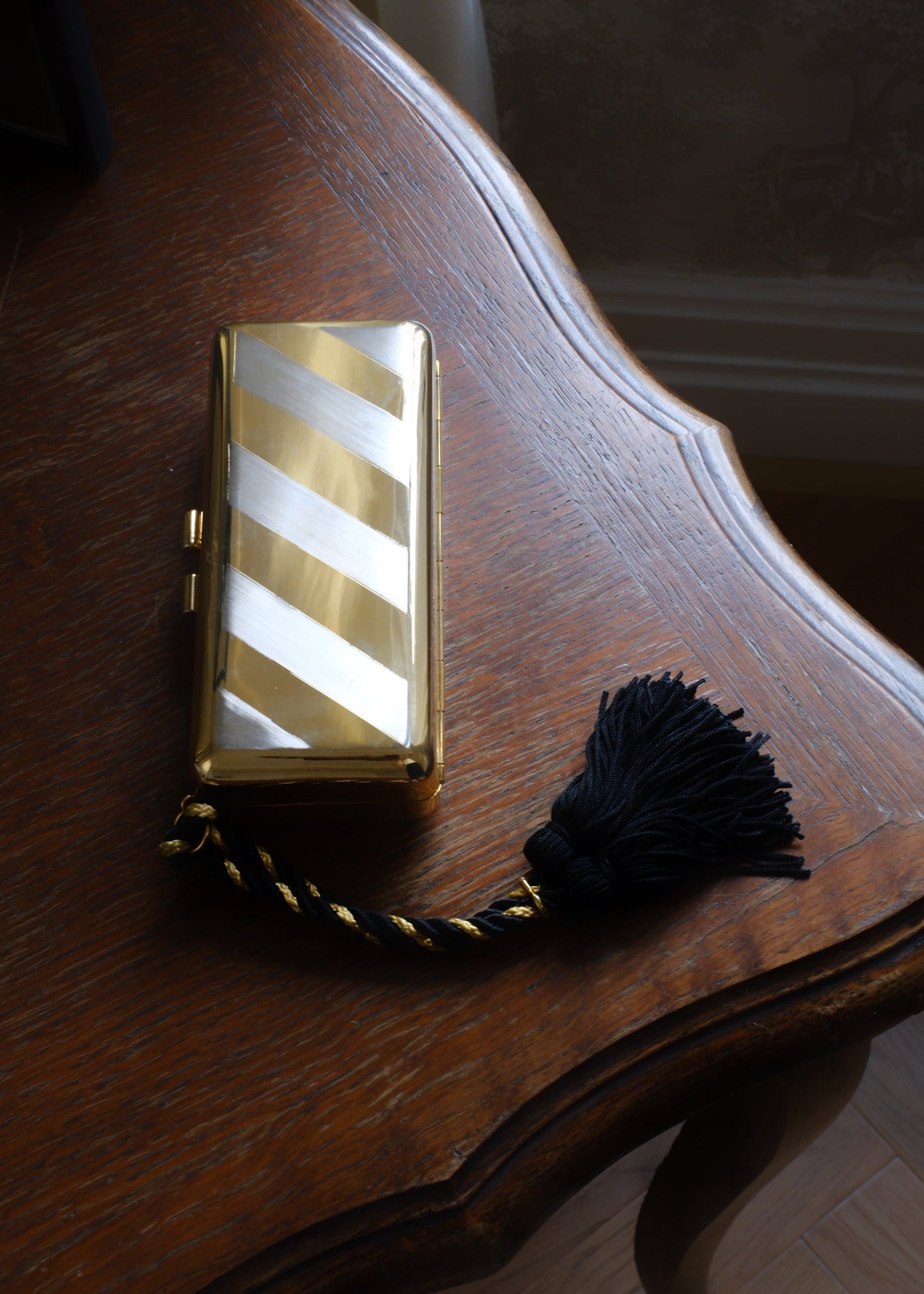 1970s  STRIPED METAL CLUTCH WITH TASSEL